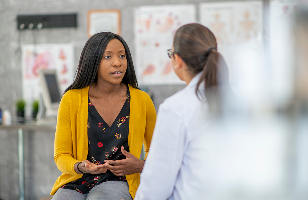 A patient talks with a healthcare provider.