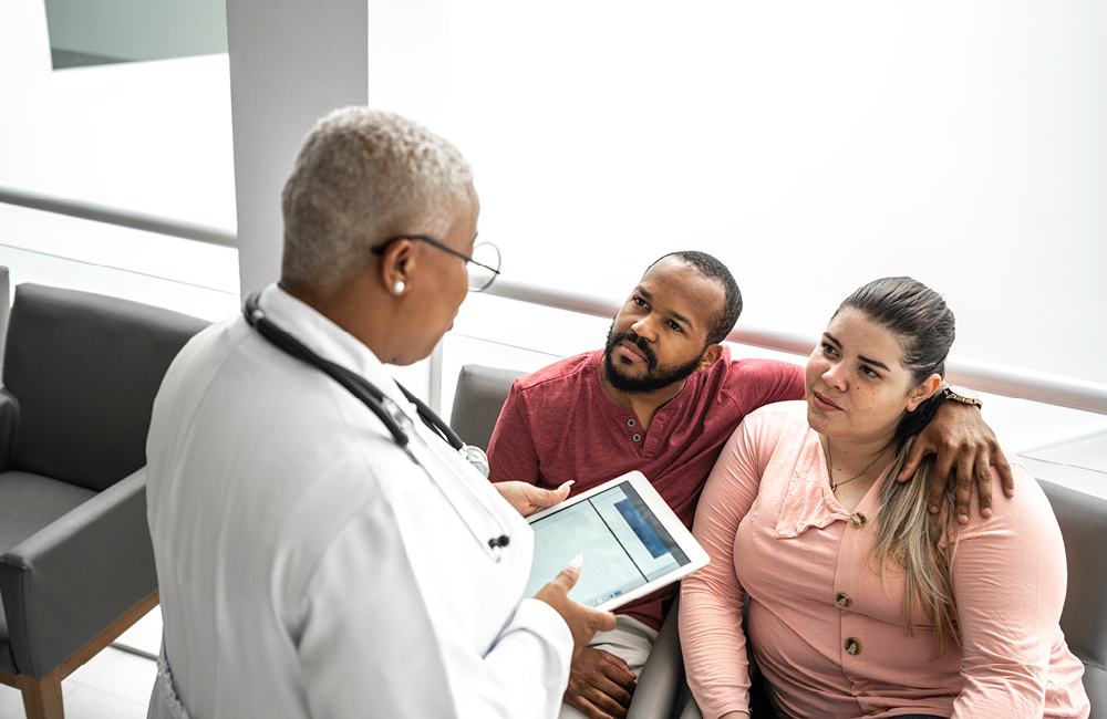 A couple meet with a healthcare provider.